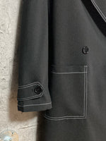 white stitched black trench coat