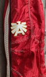 red ski pants jumpsuit Asics Austria The Eagle Knight