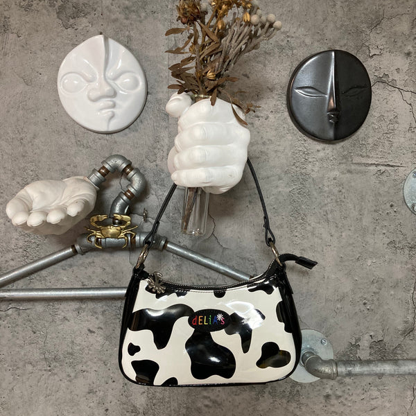 cow patterned enamel handbag white black