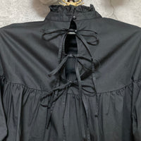 bow back black flare blouse